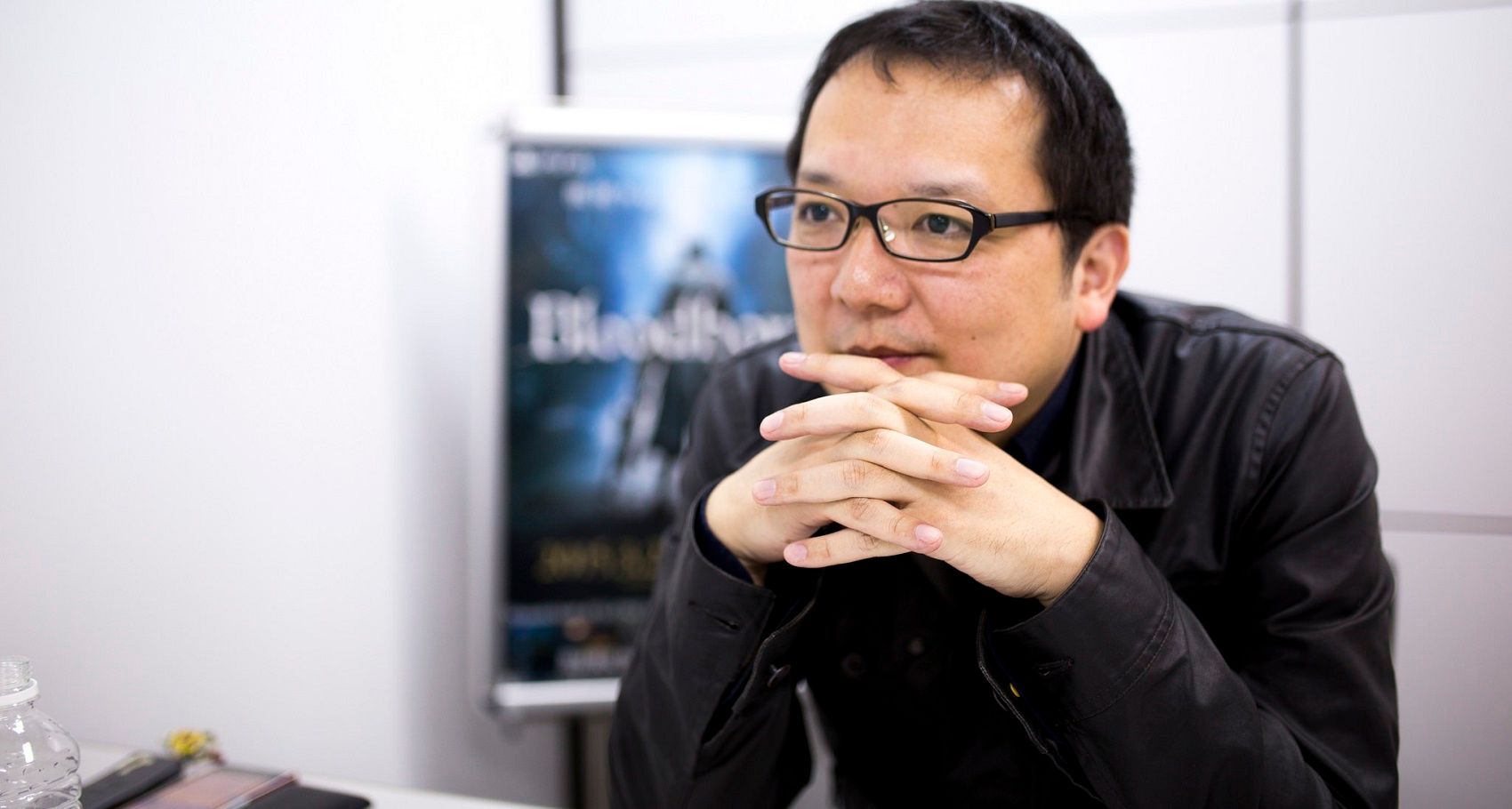 10 Things You Never Knew About Hidetaka Miyazaki The Creator Of Dark   Hidetaka Miyazaki Hands In Front Of His Face 1 